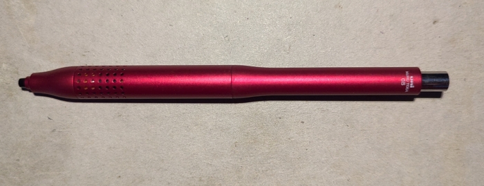 Full image of a red Kuru Toga Advance; a special lead-rotating mechanical pencil.