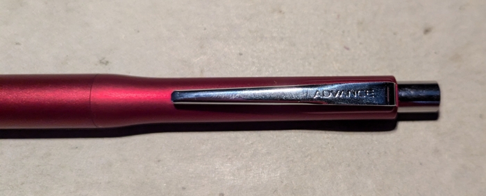 Close-up of the pencil's clip, showing off the 'Advance' branding on it.